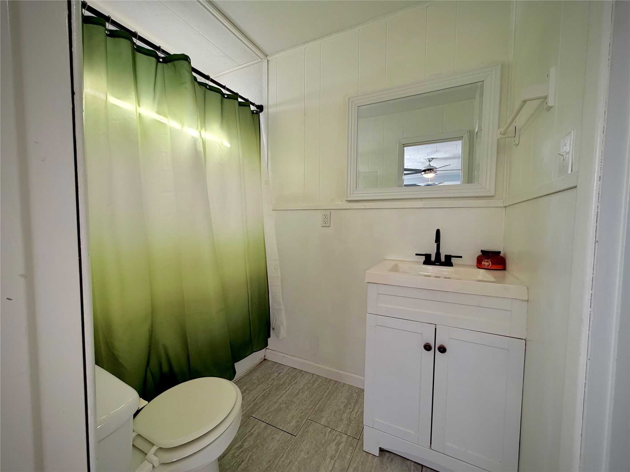 3124 30th Street Port Arthur, TX 77642 - Photo 19 of 25 a bathroom with a sink a toilet and shower