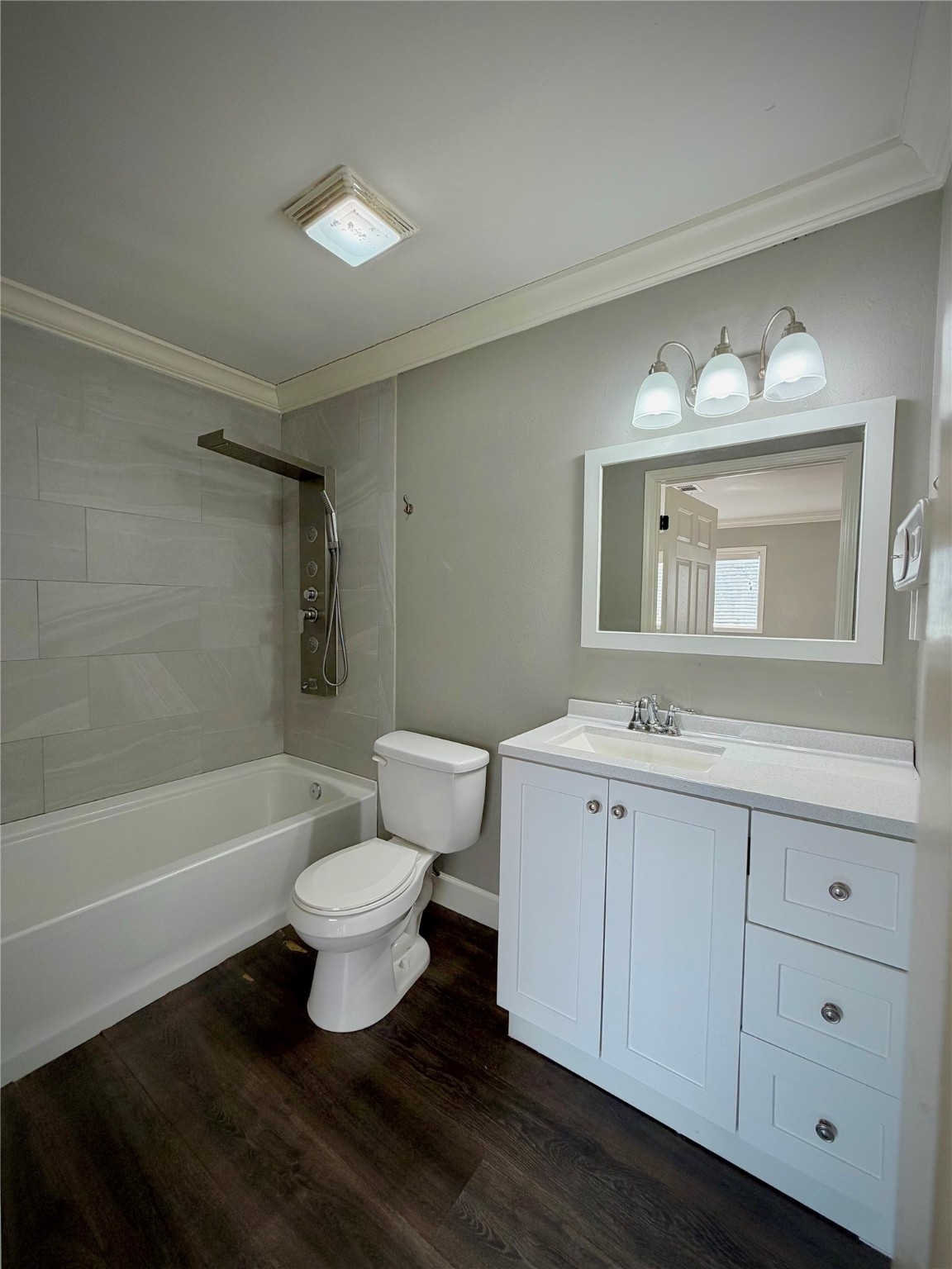 3124 30th Street Port Arthur, TX 77642 - Photo 6 of 25 a bathroom with a sink toilet a mirror and bathtub