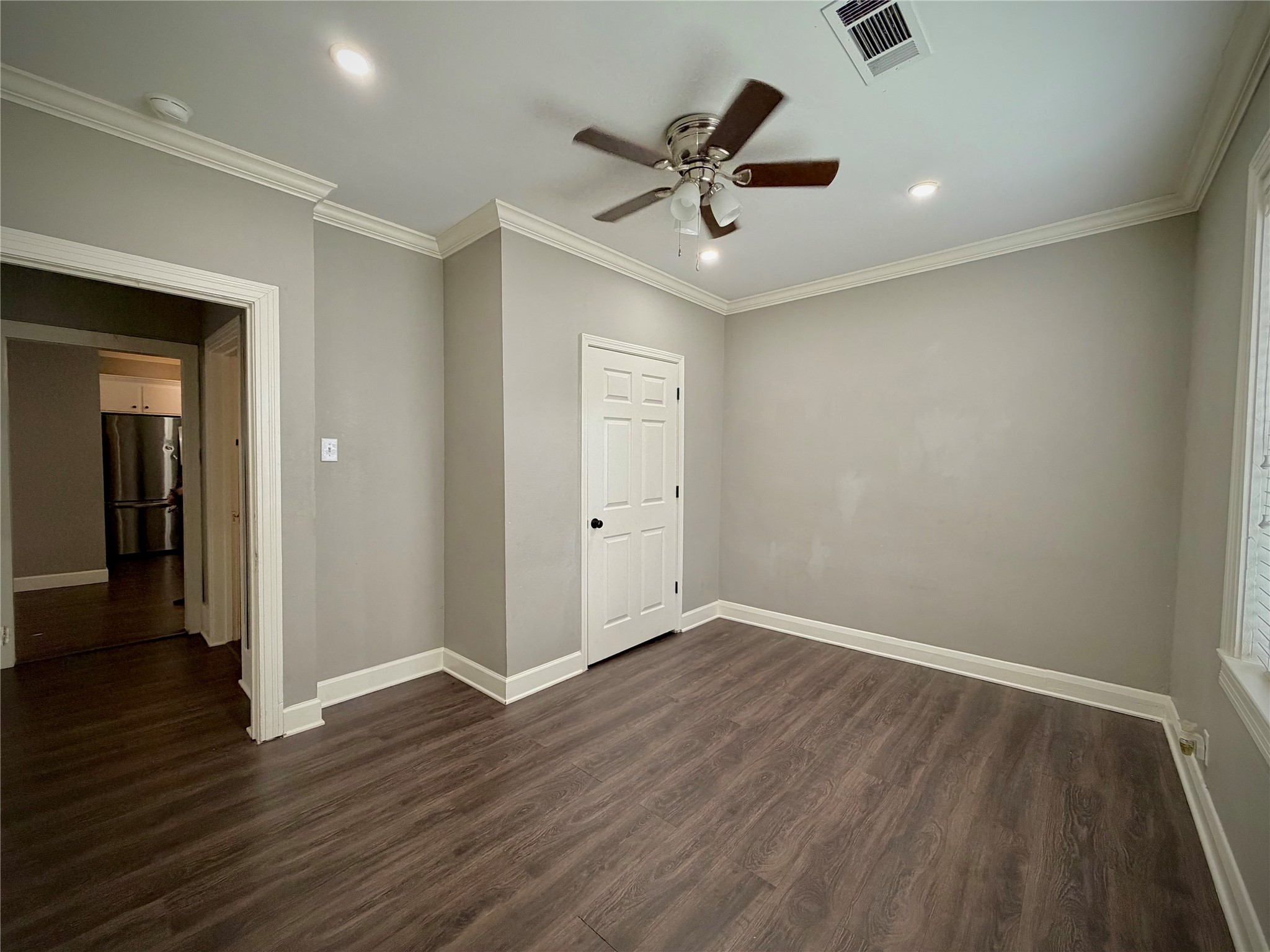 3124 30th Street Port Arthur, TX 77642 - Photo 8 of 25 wooden floor in an empty room with a window