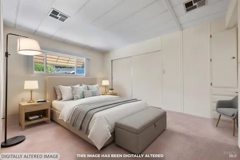 a bedroom with a bed and a chair
