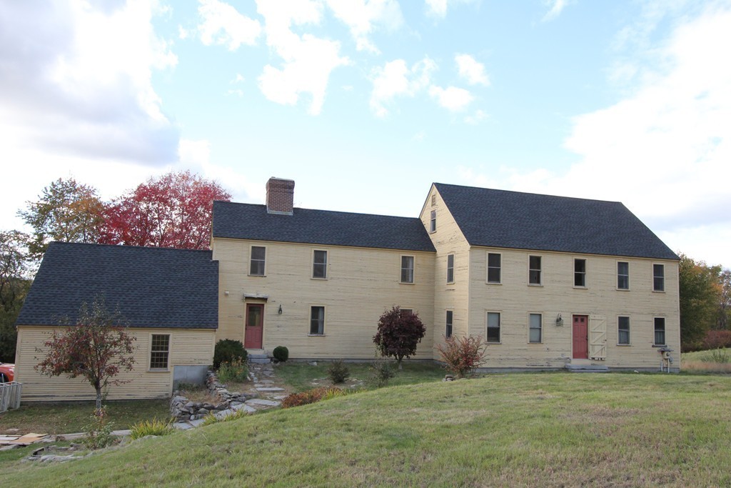 340 Still River Road Harvard, MA 01451 - Photo 13 of 13 a view of a white house with a big yard and large tree