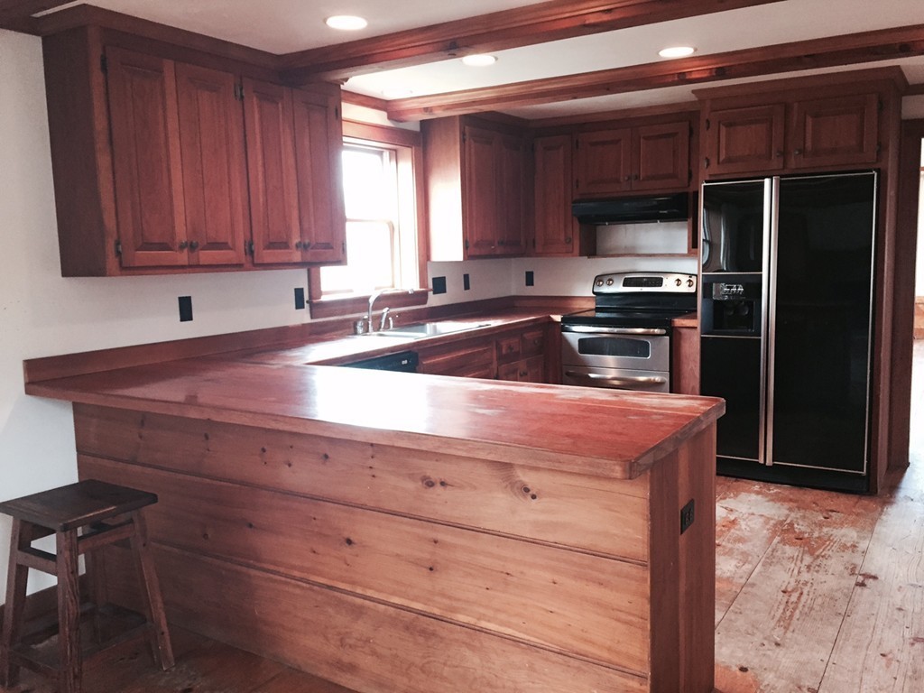 340 Still River Road Harvard, MA 01451 - Photo 5 of 13 a kitchen with appliances a sink and cabinets