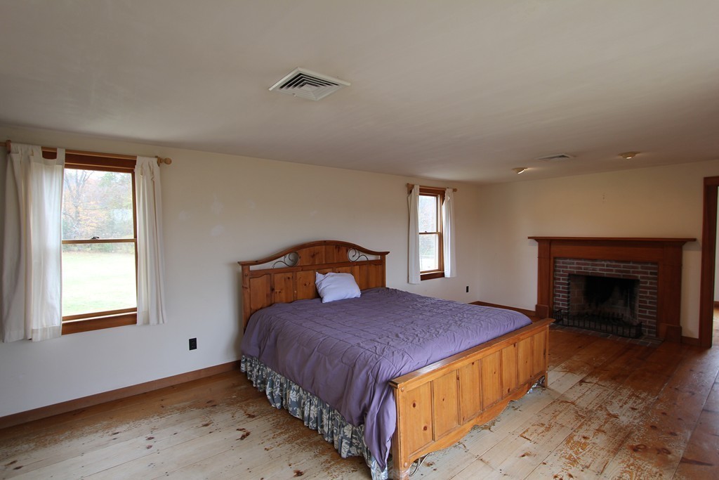 340 Still River Road Harvard, MA 01451 - Photo 8 of 13 a bedroom with a bed and a window