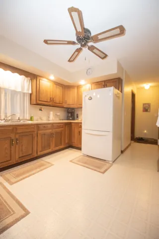 a view of a kitchen with a sink and cabinets