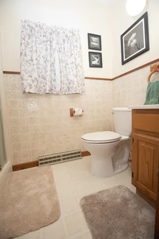 a bathroom with a toilet and a sink