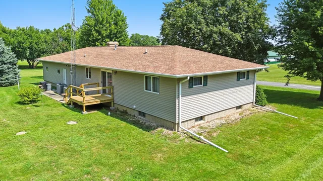 a backyard of a house with yard barbeque oven and outdoor seating