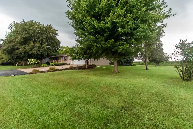 a view of outdoor space with deck and yard