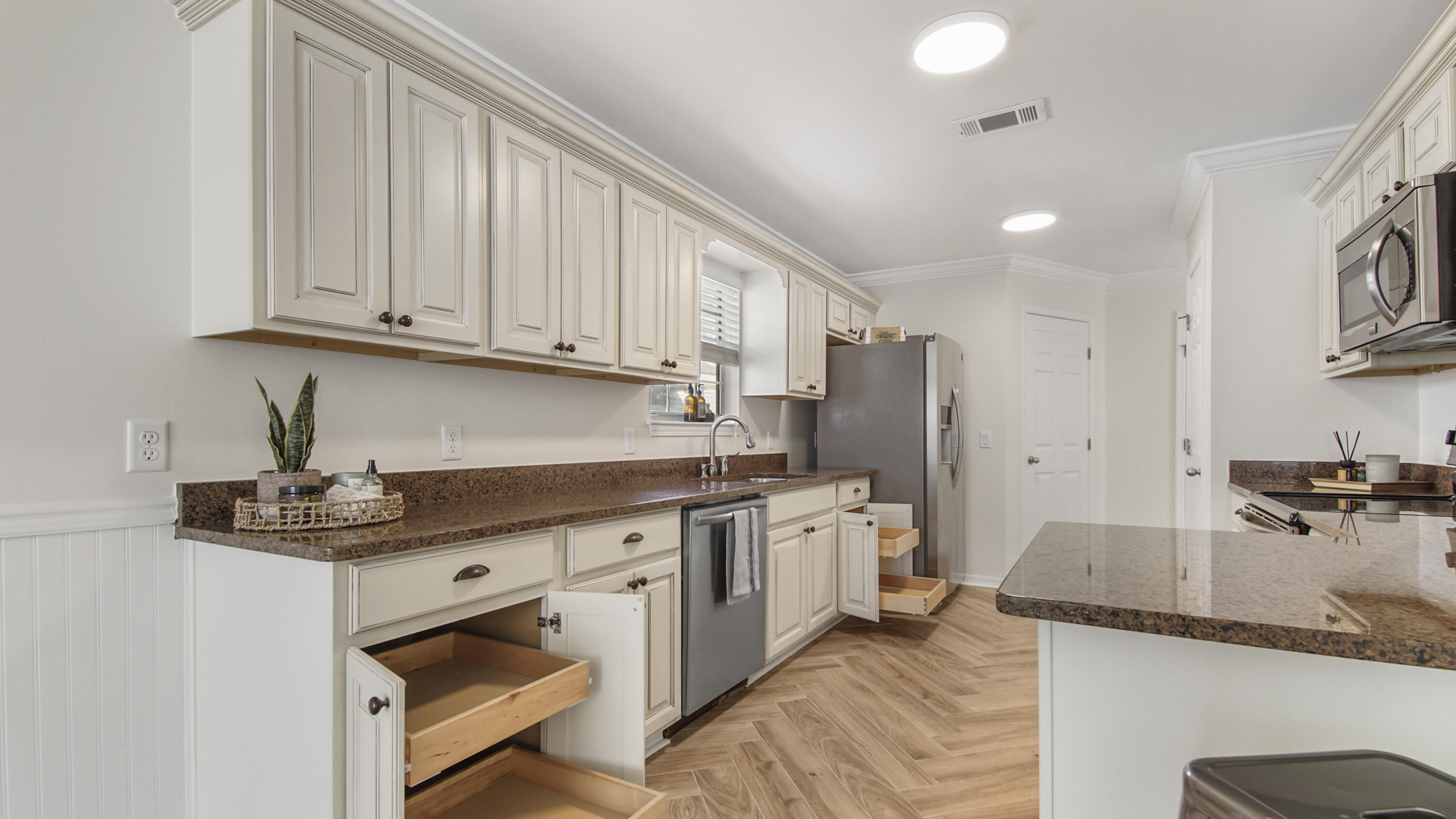 302 Liriope Loop Destin, FL 32541 - Photo 14 of 59 a kitchen with stainless steel appliances granite countertop a sink stove and refrigerator