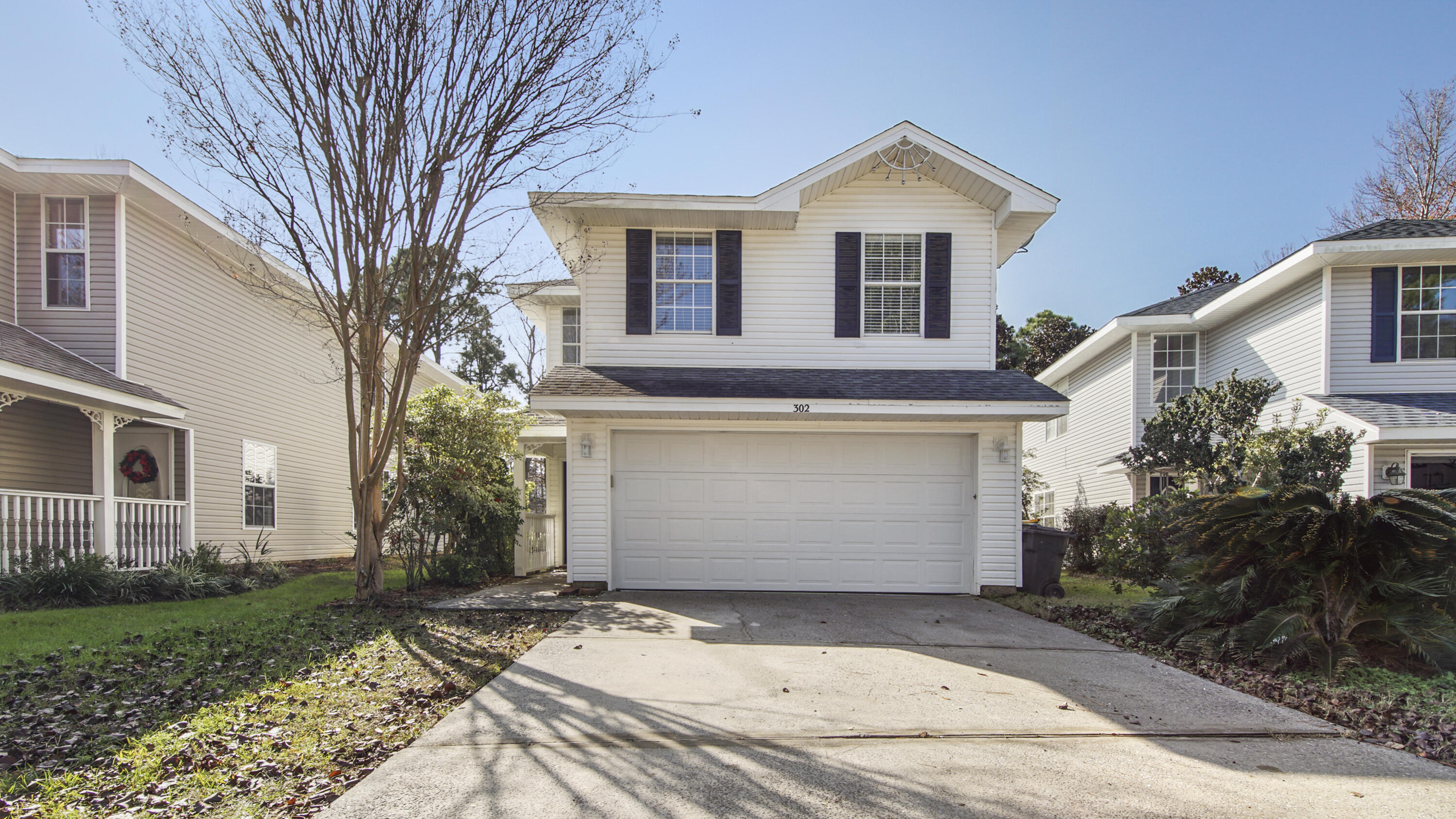 302 Liriope Loop Destin, FL 32541 - Photo 2 of 59 a front view of house with yard