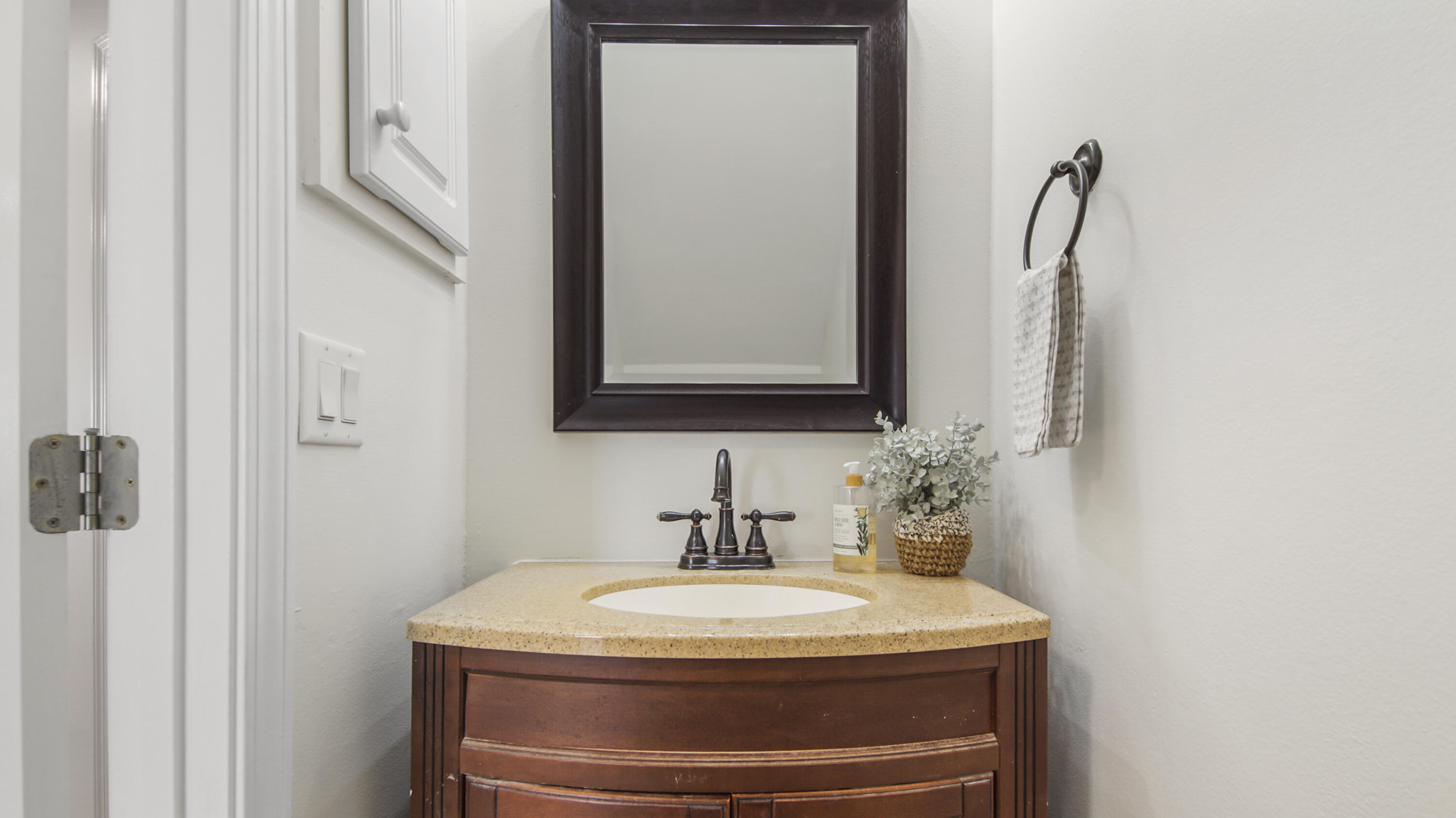 302 Liriope Loop Destin, FL 32541 - Photo 23 of 59 a bathroom with a sink and a mirror