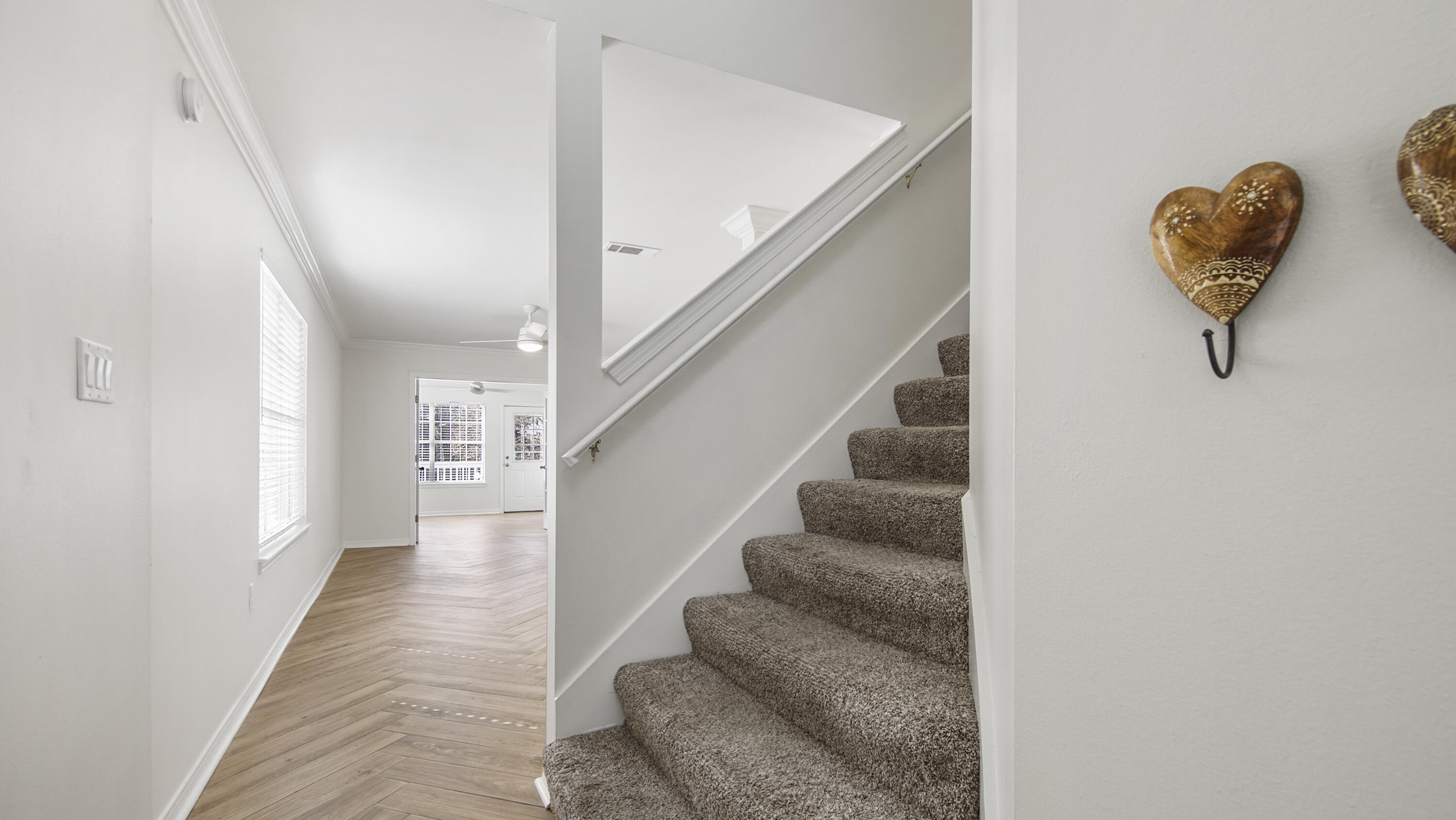 302 Liriope Loop Destin, FL 32541 - Photo 24 of 59 a view of entryway and hall with wooden floor