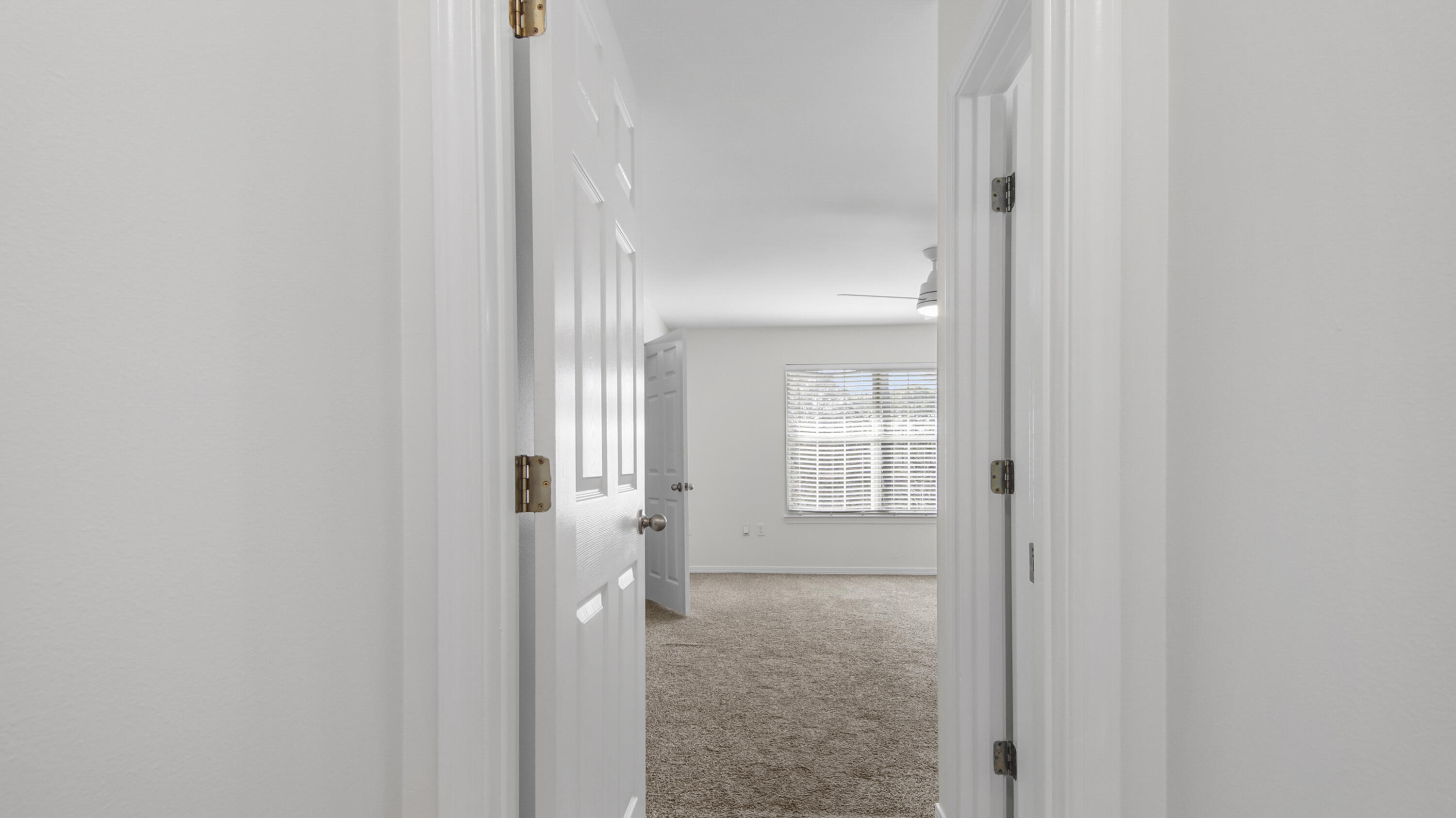 302 Liriope Loop Destin, FL 32541 - Photo 30 of 59 a view of a bathroom from a hallway