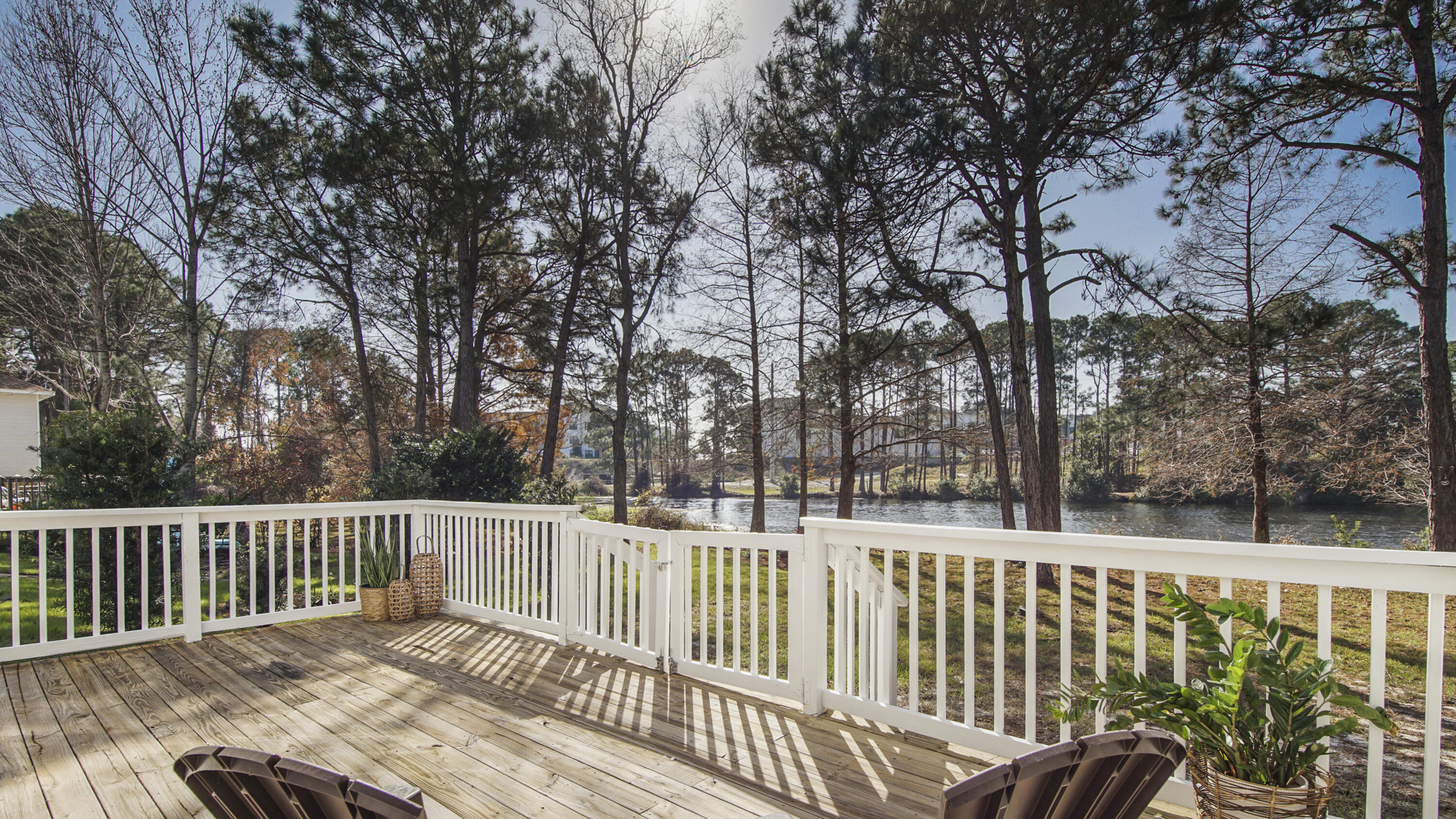 302 Liriope Loop Destin, FL 32541 - Photo 3 of 59 a view of a wooden roof deck