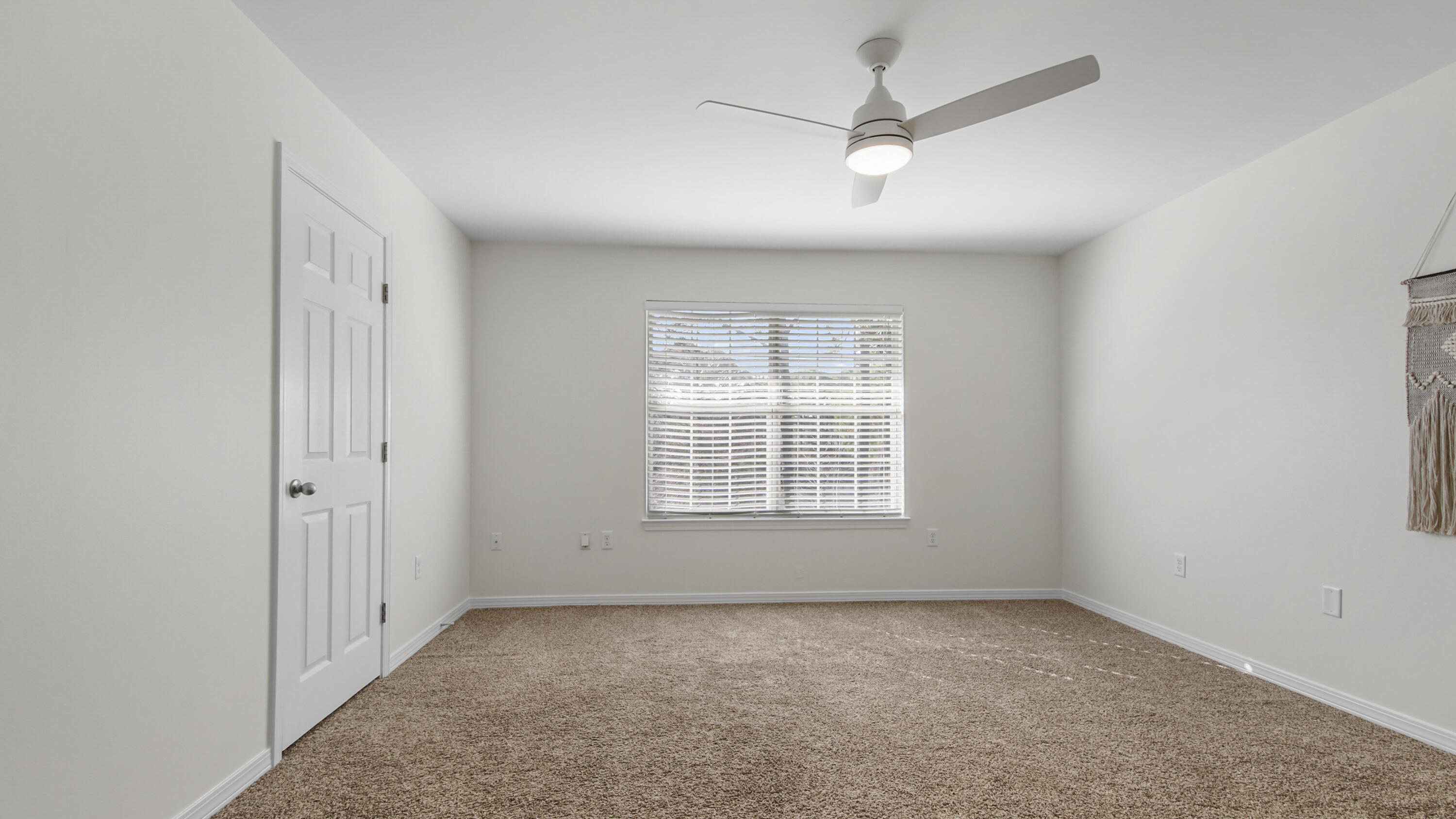 302 Liriope Loop Destin, FL 32541 - Photo 31 of 59 an empty room with a ceiling fan and a window