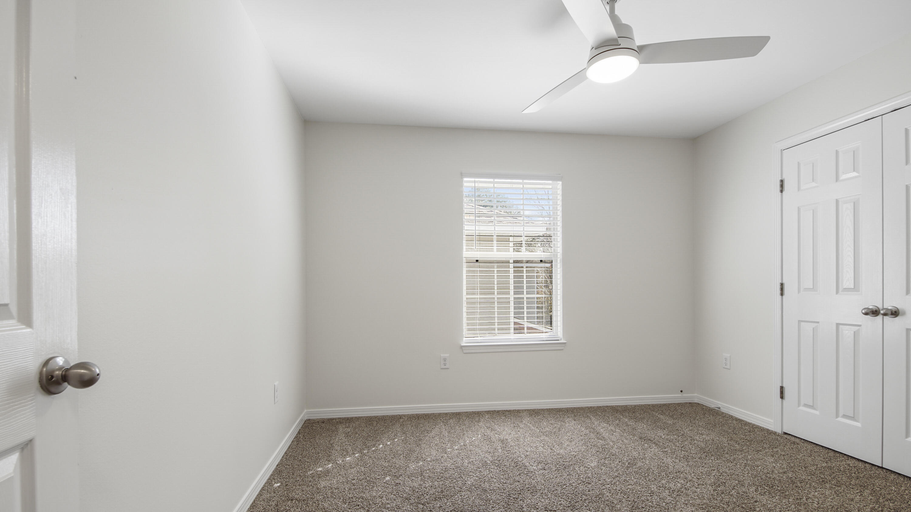 302 Liriope Loop Destin, FL 32541 - Photo 40 of 59 an empty room with windows and closet