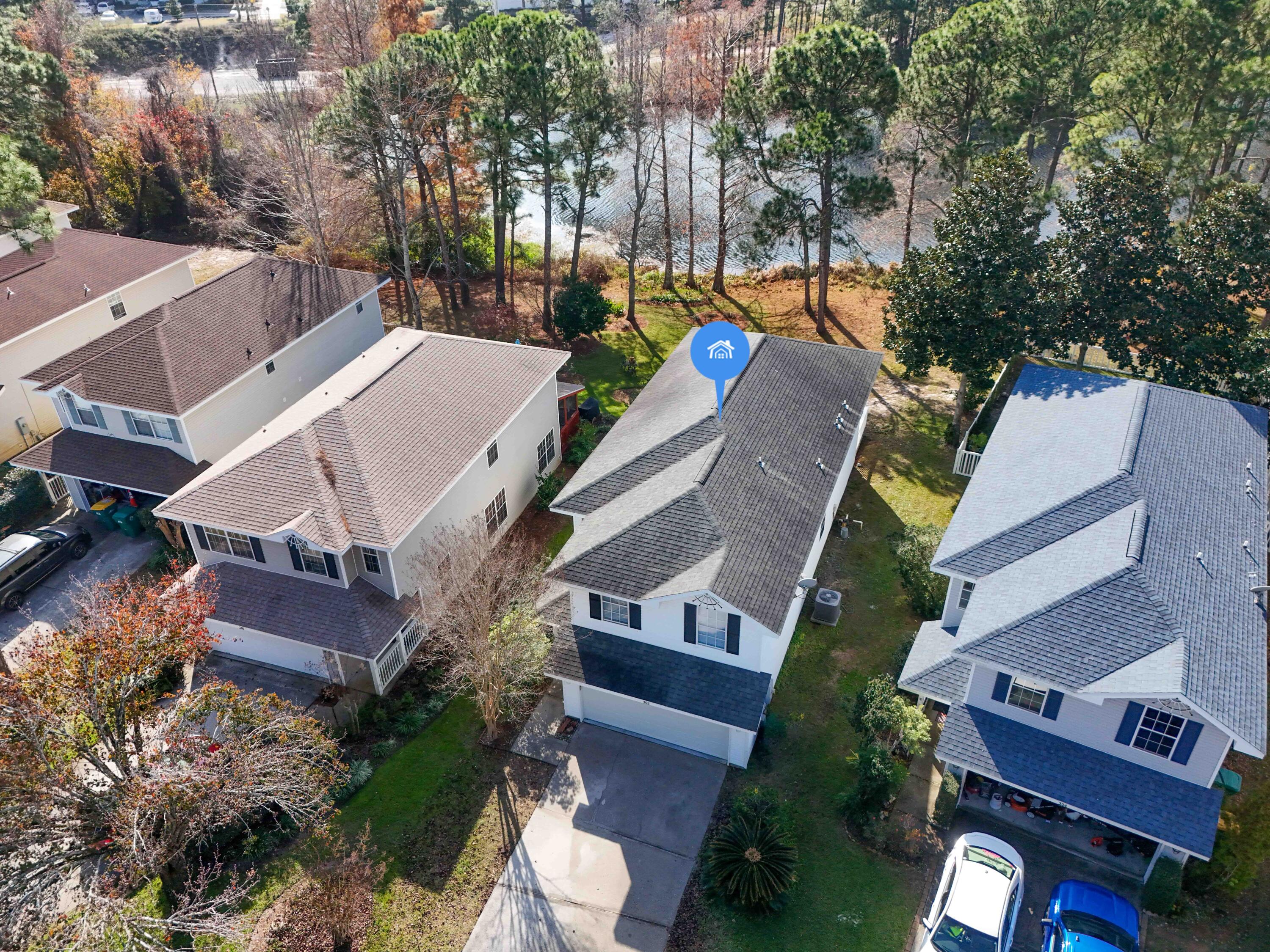 302 Liriope Loop Destin, FL 32541 - Photo 4 of 59 an aerial view of houses with yard