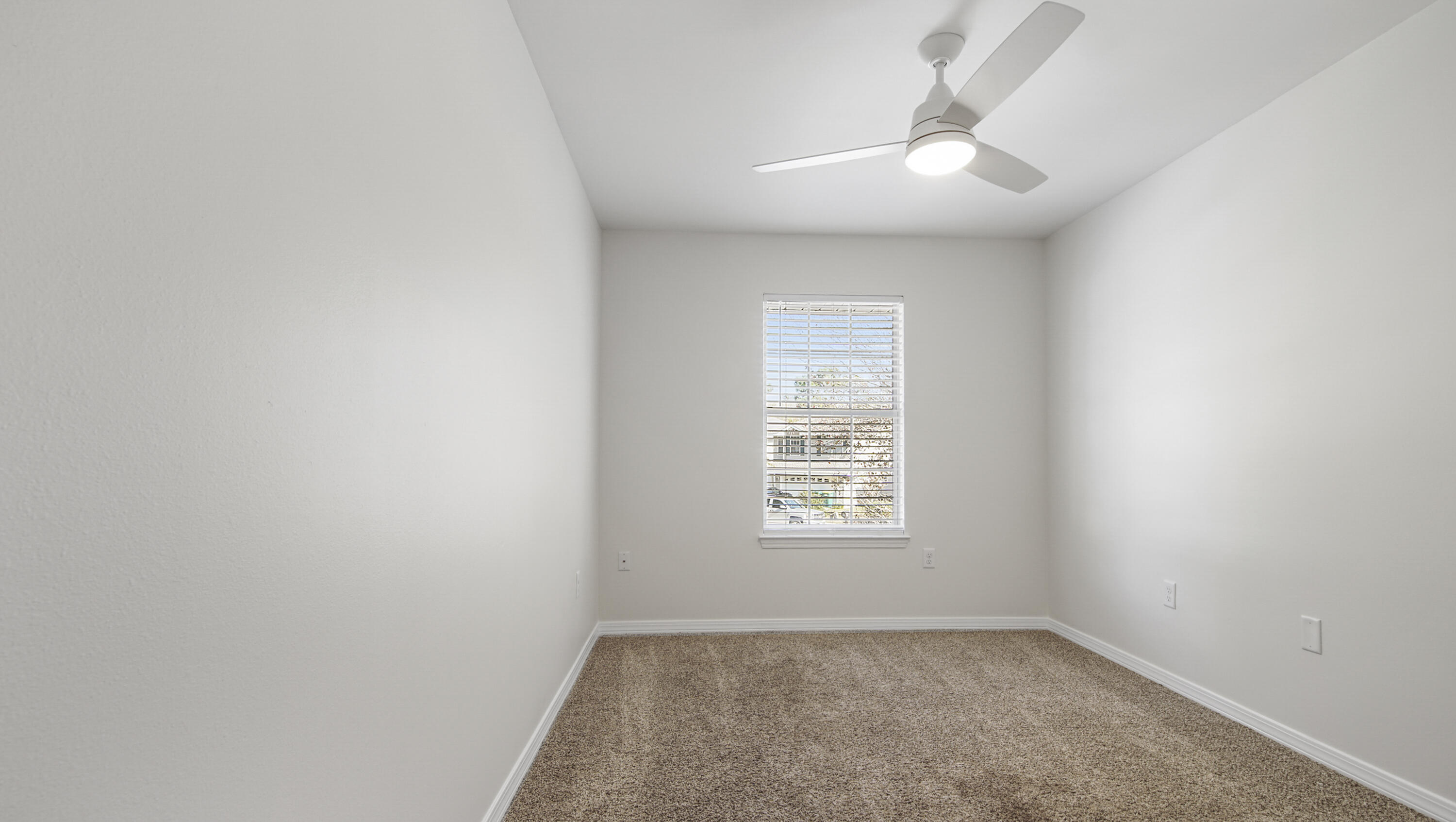 302 Liriope Loop Destin, FL 32541 - Photo 45 of 59 an empty room with windows and fan