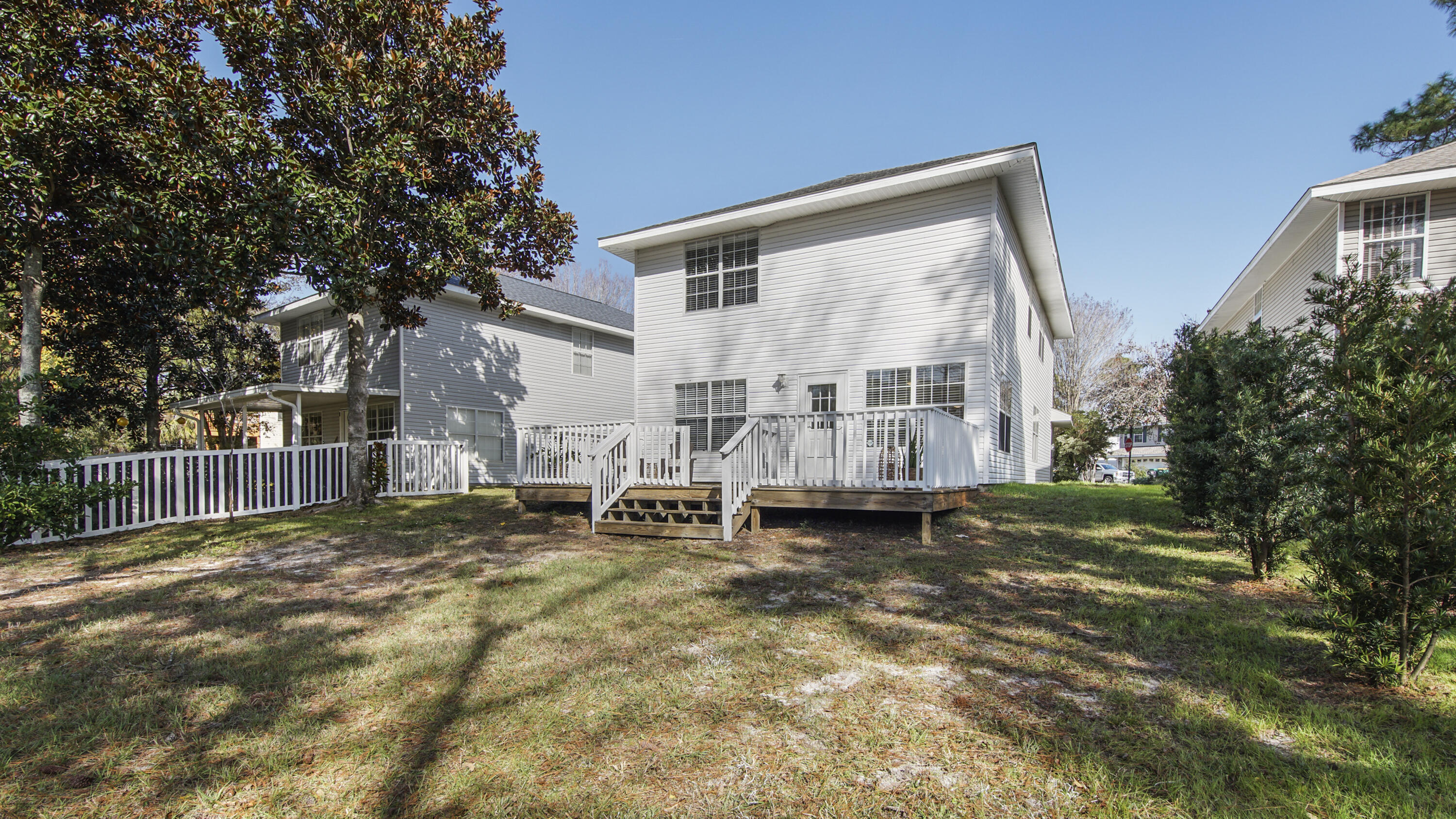 302 Liriope Loop Destin, FL 32541 - Photo 48 of 59 a view of a house with backyard porch and sitting area