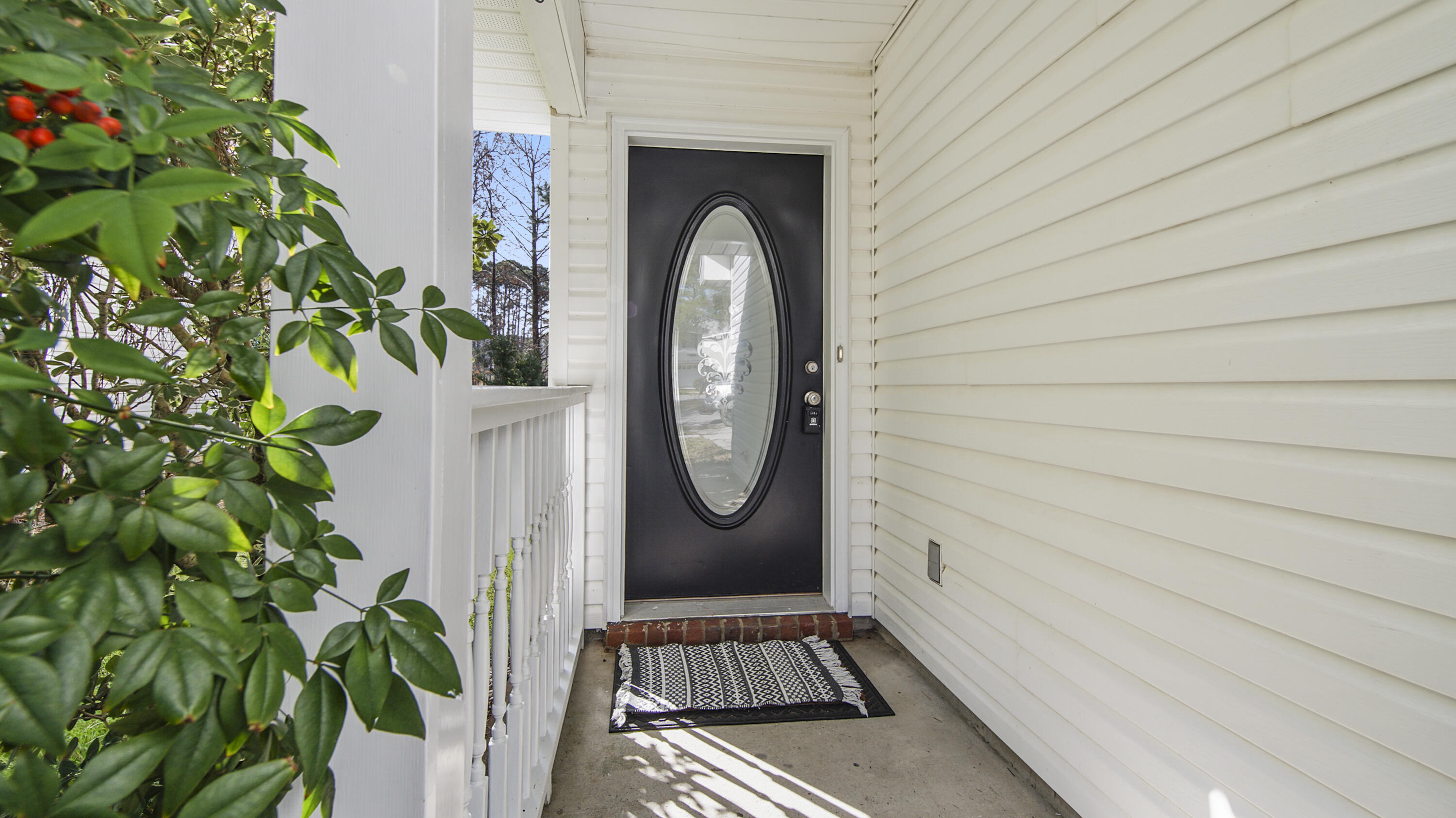 302 Liriope Loop Destin, FL 32541 - Photo 7 of 59 a view of a entryway door of the house