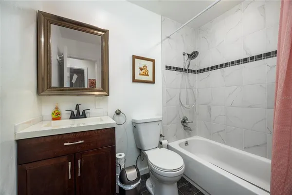 a bathroom with a sink a toilet and a bathtub