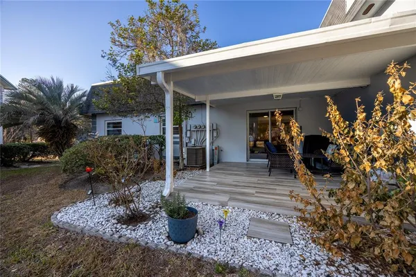 a view of a house with patio outdoor seating
