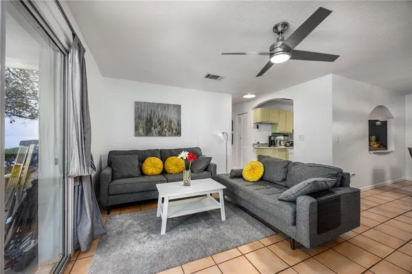 a living room with furniture and a rug