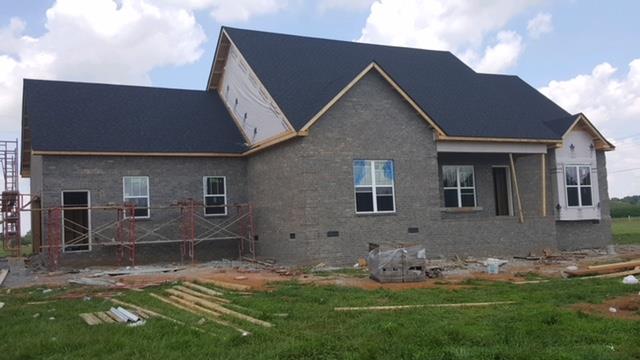 108 Philpot Road Bell Buckle, TN 37020 - Photo 1 of 2 a house with garden in front of it