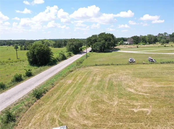 a view of a lake with a big yard