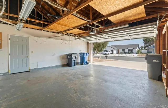 a view of garage with red and white walls