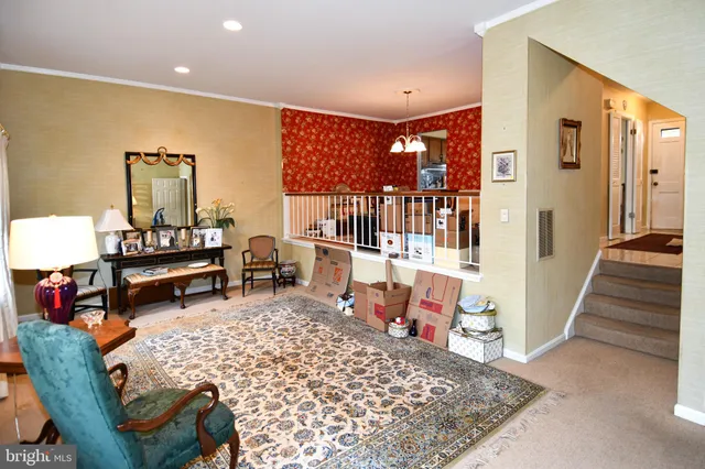 a living room with furniture and a rug