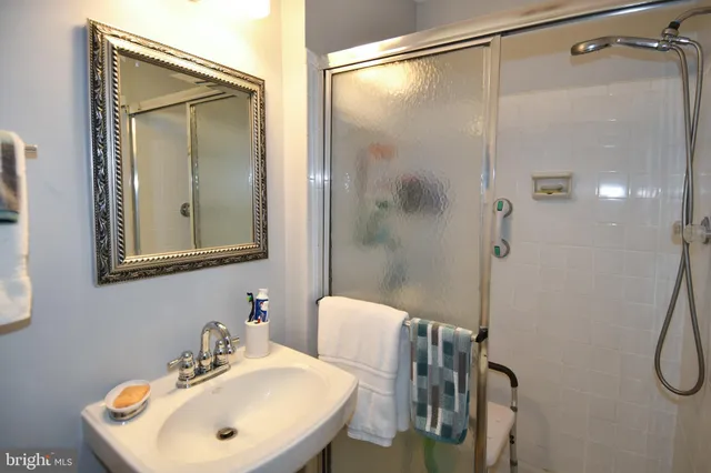 a bathroom with a sink and mirror