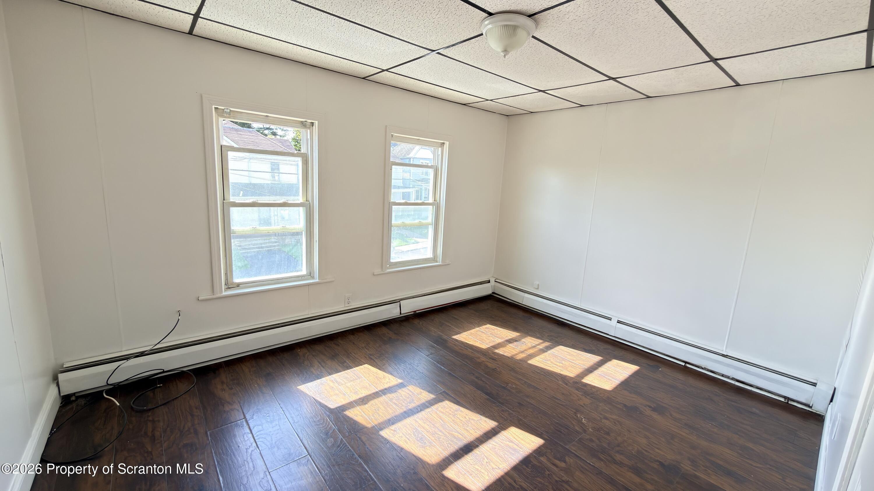 2115-2117 Wayne Avenue Scranton, PA 18508 - Photo 15 of 44 a view of empty room with wooden floor