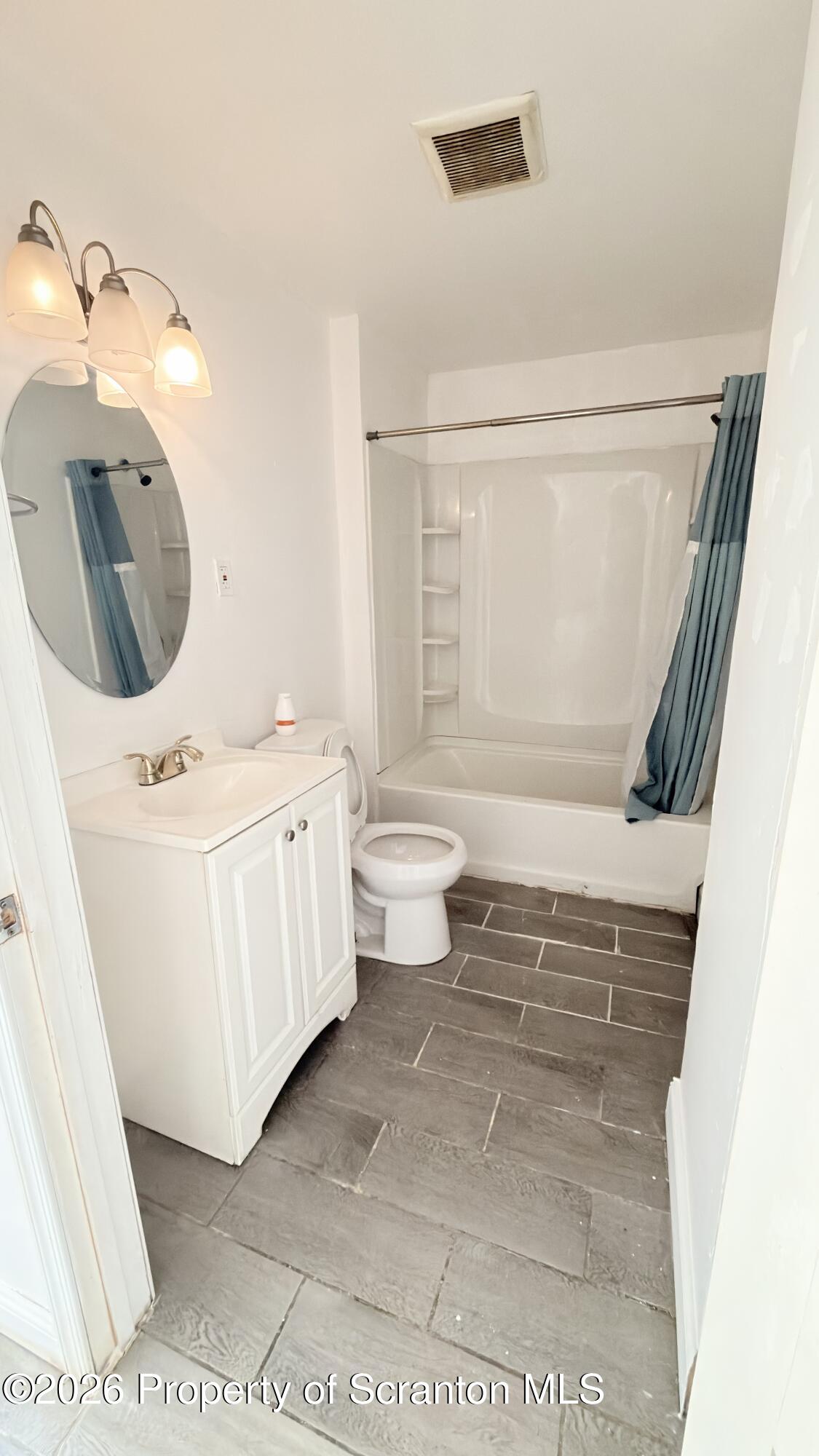 2115-2117 Wayne Avenue Scranton, PA 18508 - Photo 16 of 44 a bathroom with a sink a toilet and bathtub