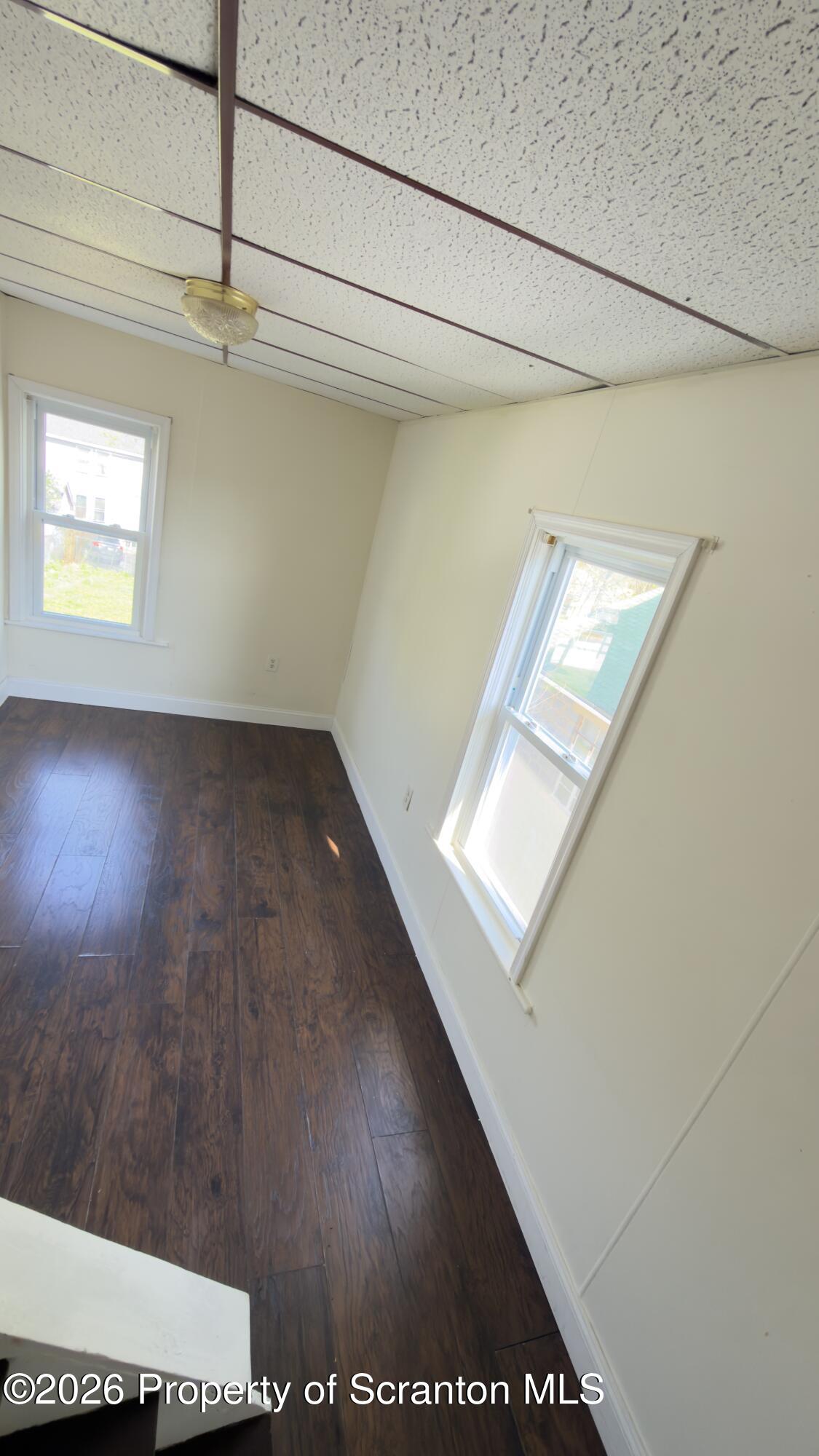 2115-2117 Wayne Avenue Scranton, PA 18508 - Photo 26 of 44 a view of hallway with wooden floor and cabinet