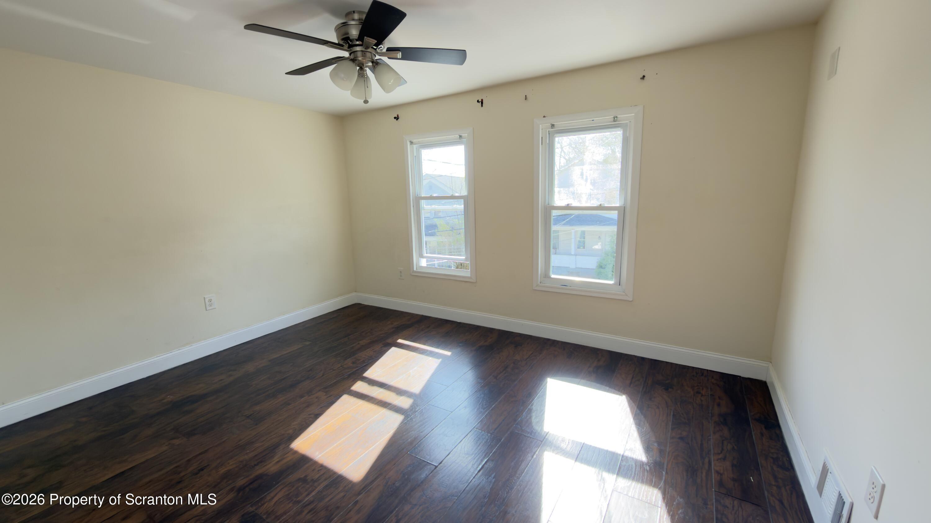 2115-2117 Wayne Avenue Scranton, PA 18508 - Photo 29 of 44 a view of empty room with wooden floor and fan