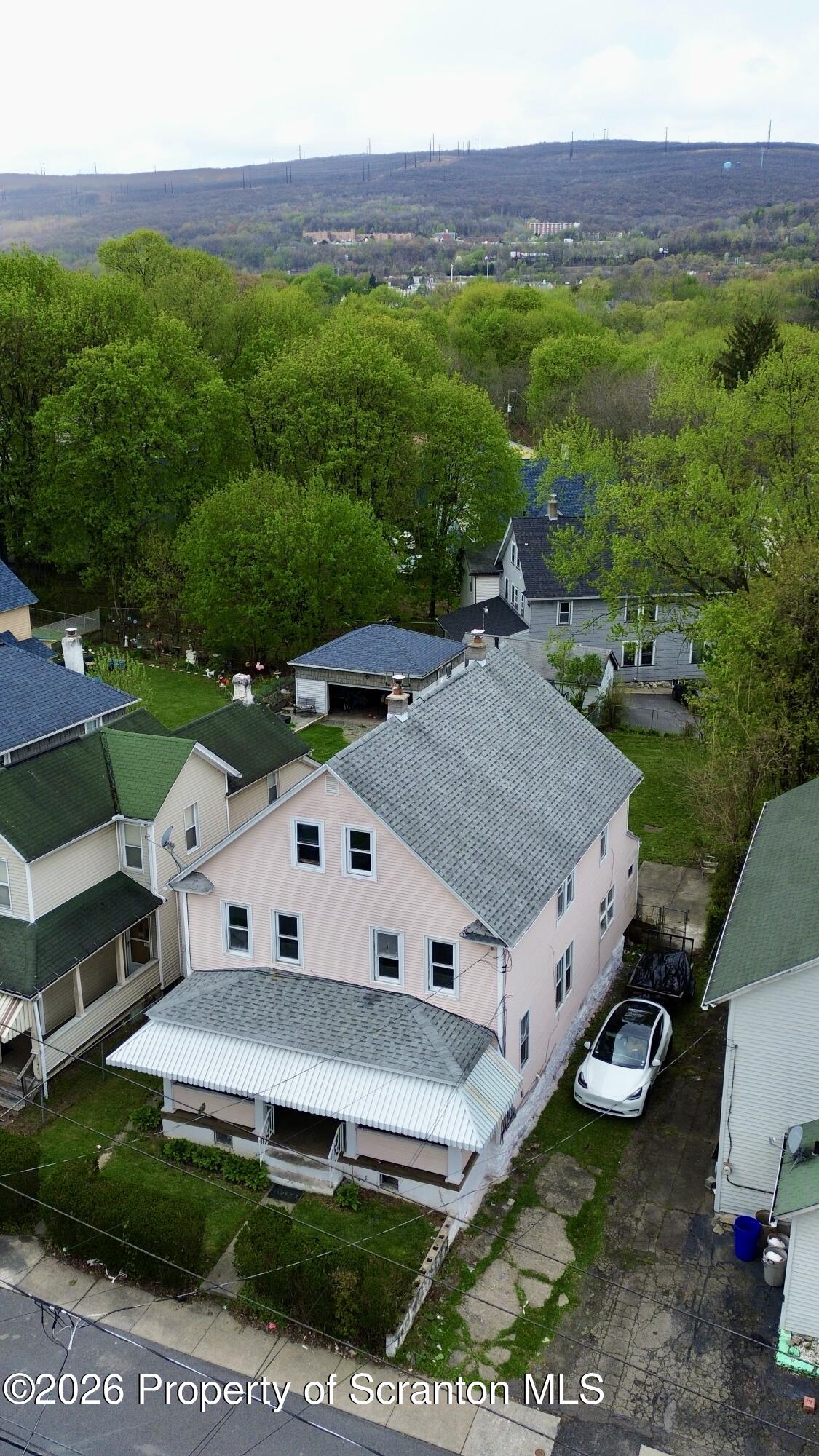 2115-2117 Wayne Avenue Scranton, PA 18508 - Photo 5 of 44 a aerial view of a house with a yard