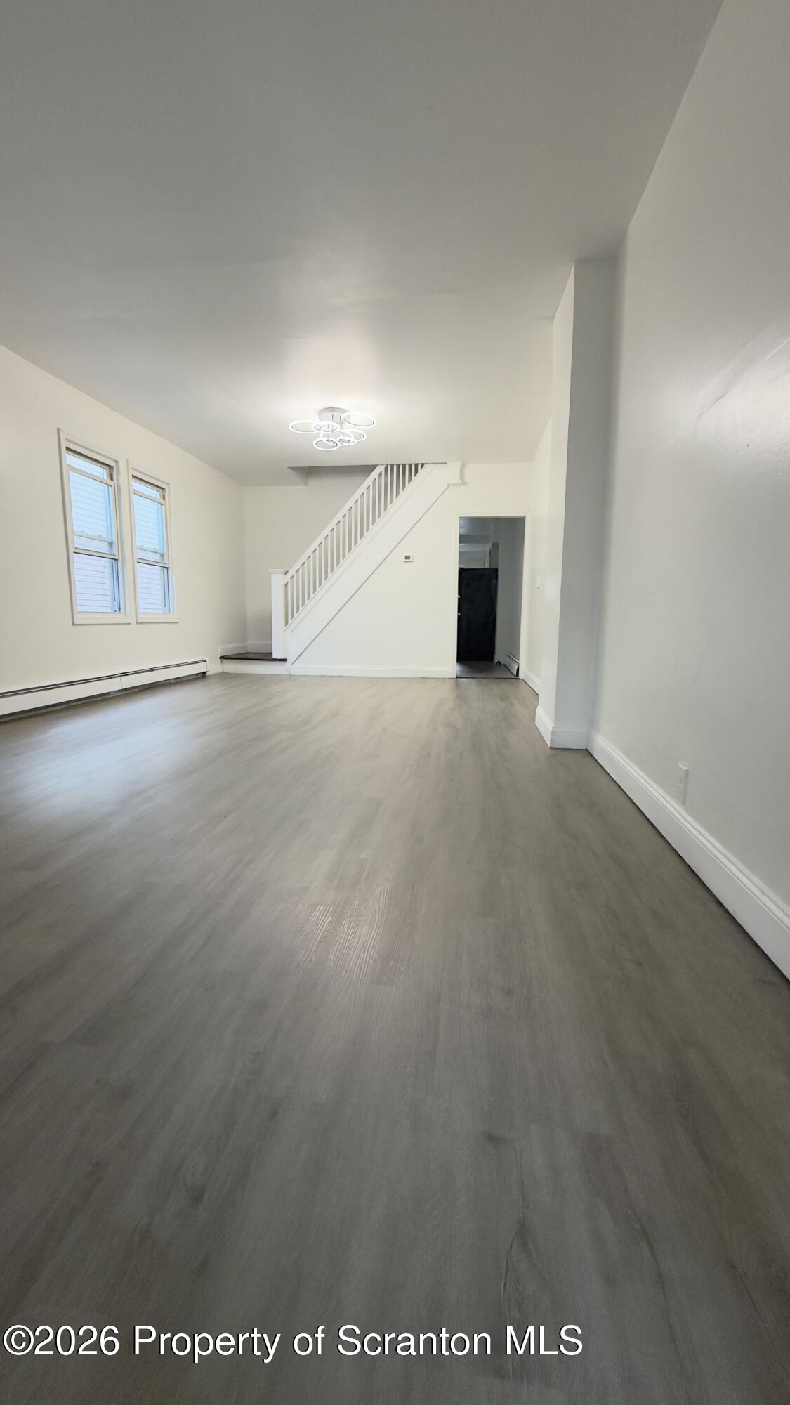 2115-2117 Wayne Avenue Scranton, PA 18508 - Photo 6 of 44 an empty room with a empty space and windows