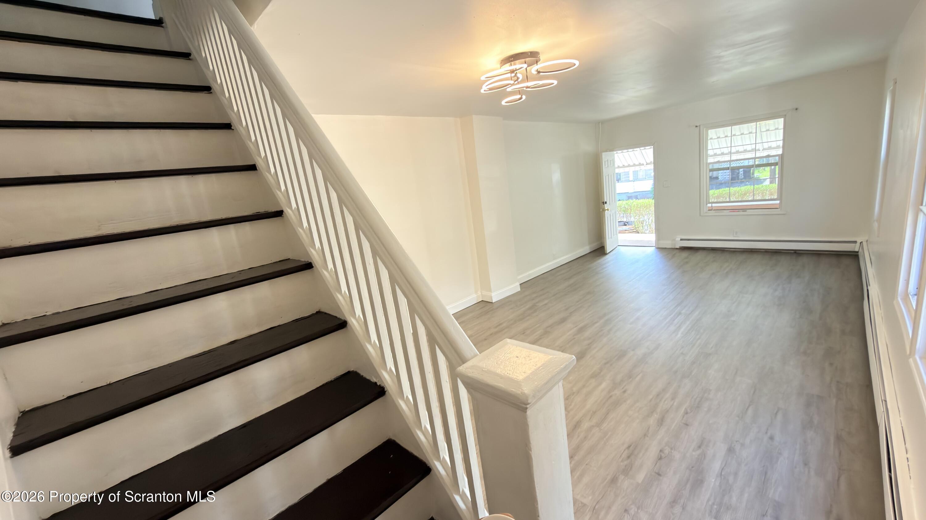 2115-2117 Wayne Avenue Scranton, PA 18508 - Photo 8 of 44 a view of entryway and hall with wooden floor