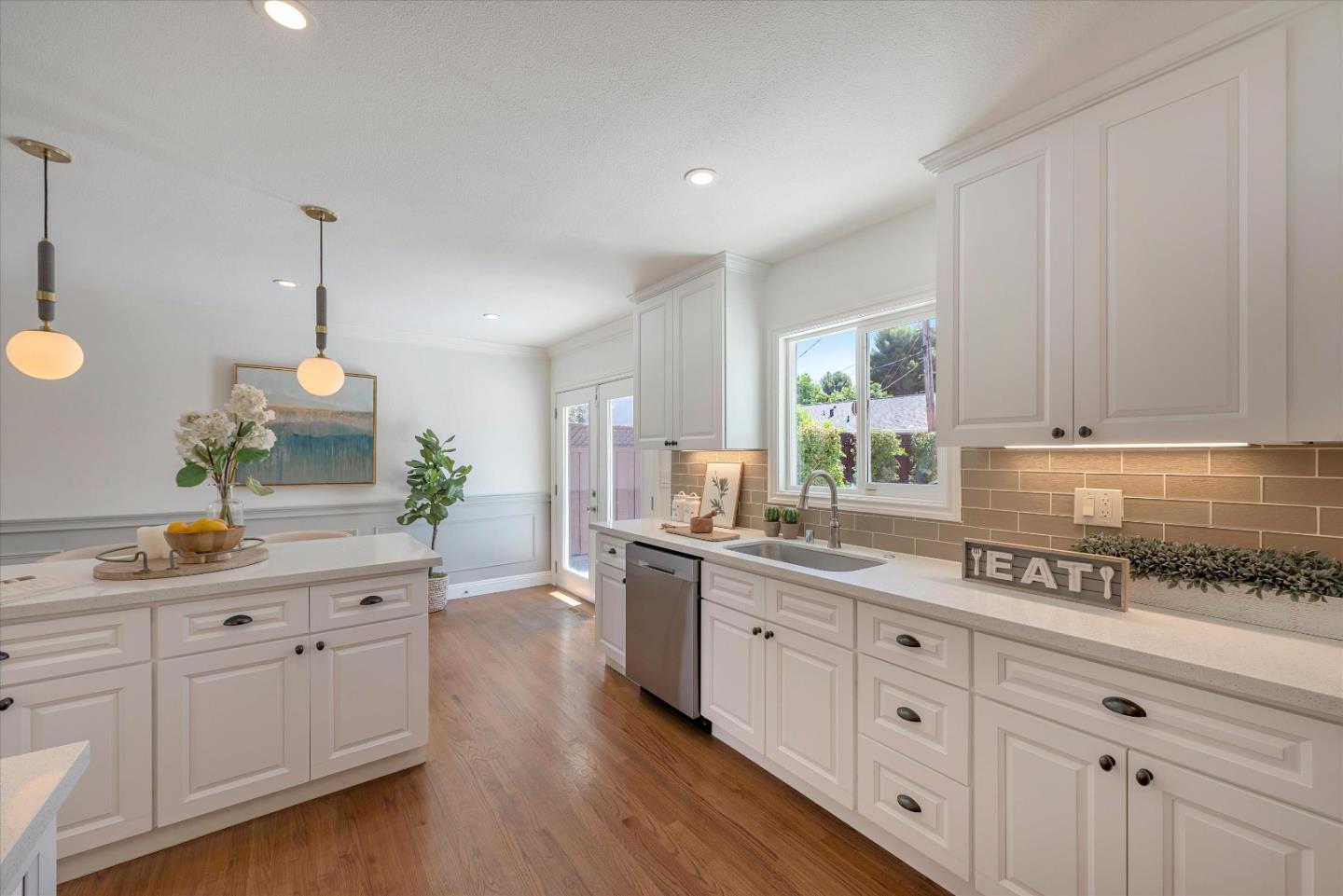 1314 Crestfield Drive San Jose, CA 95125 - Photo 14 of 43 a kitchen with white cabinets and white appliances