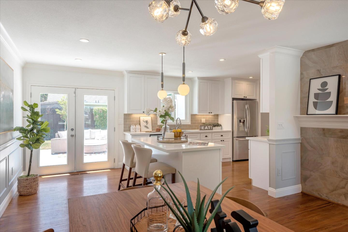 1314 Crestfield Drive San Jose, CA 95125 - Photo 16 of 43 a view of a dining room and livingroom with furniture wooden floor a chandelier