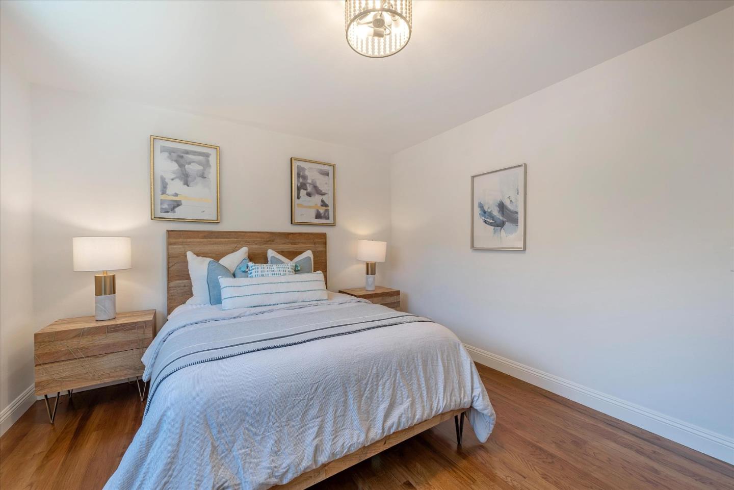 1314 Crestfield Drive San Jose, CA 95125 - Photo 19 of 43 a bedroom with a bed and a lamp