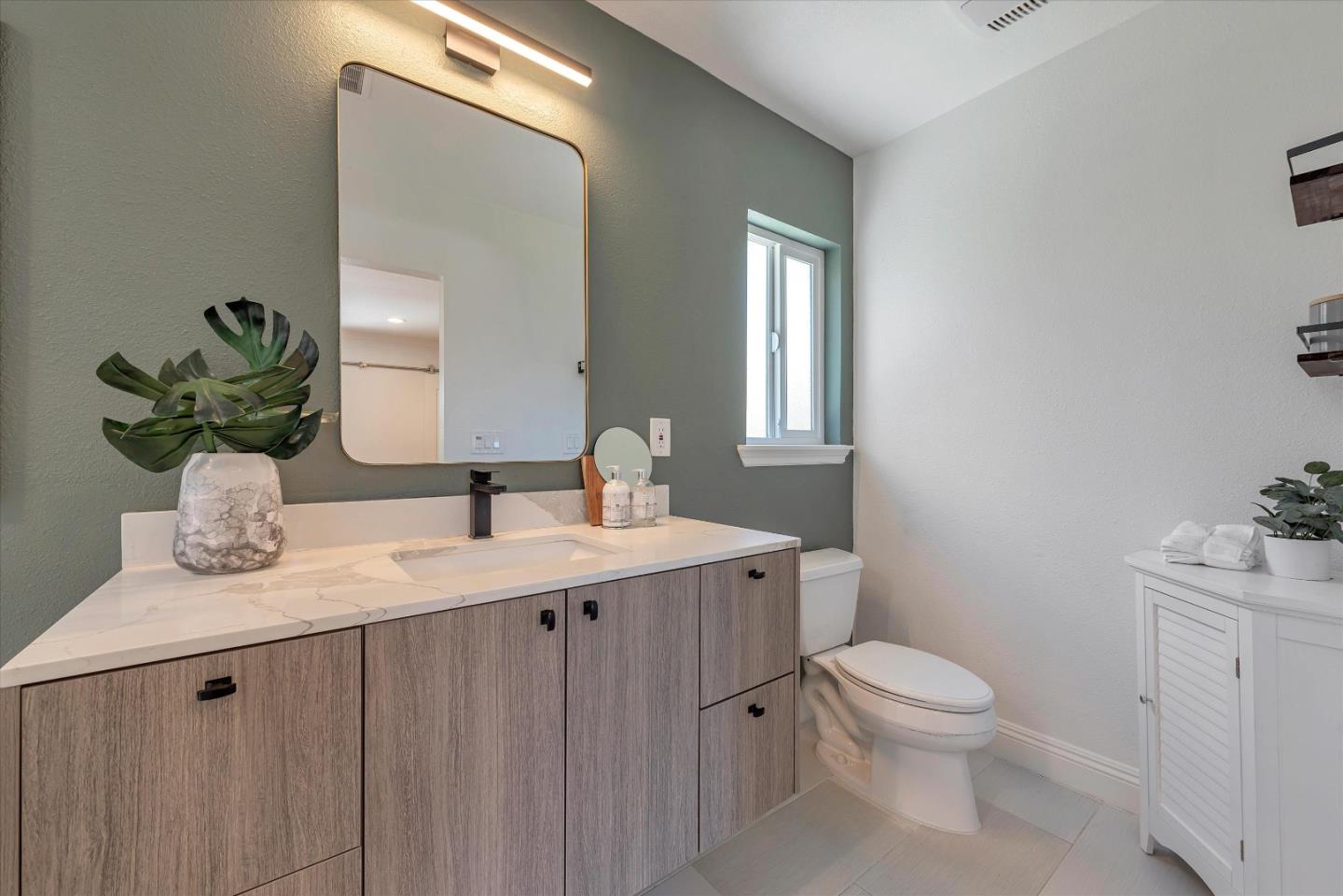 1314 Crestfield Drive San Jose, CA 95125 - Photo 26 of 43 a bathroom with a granite countertop toilet sink and mirror