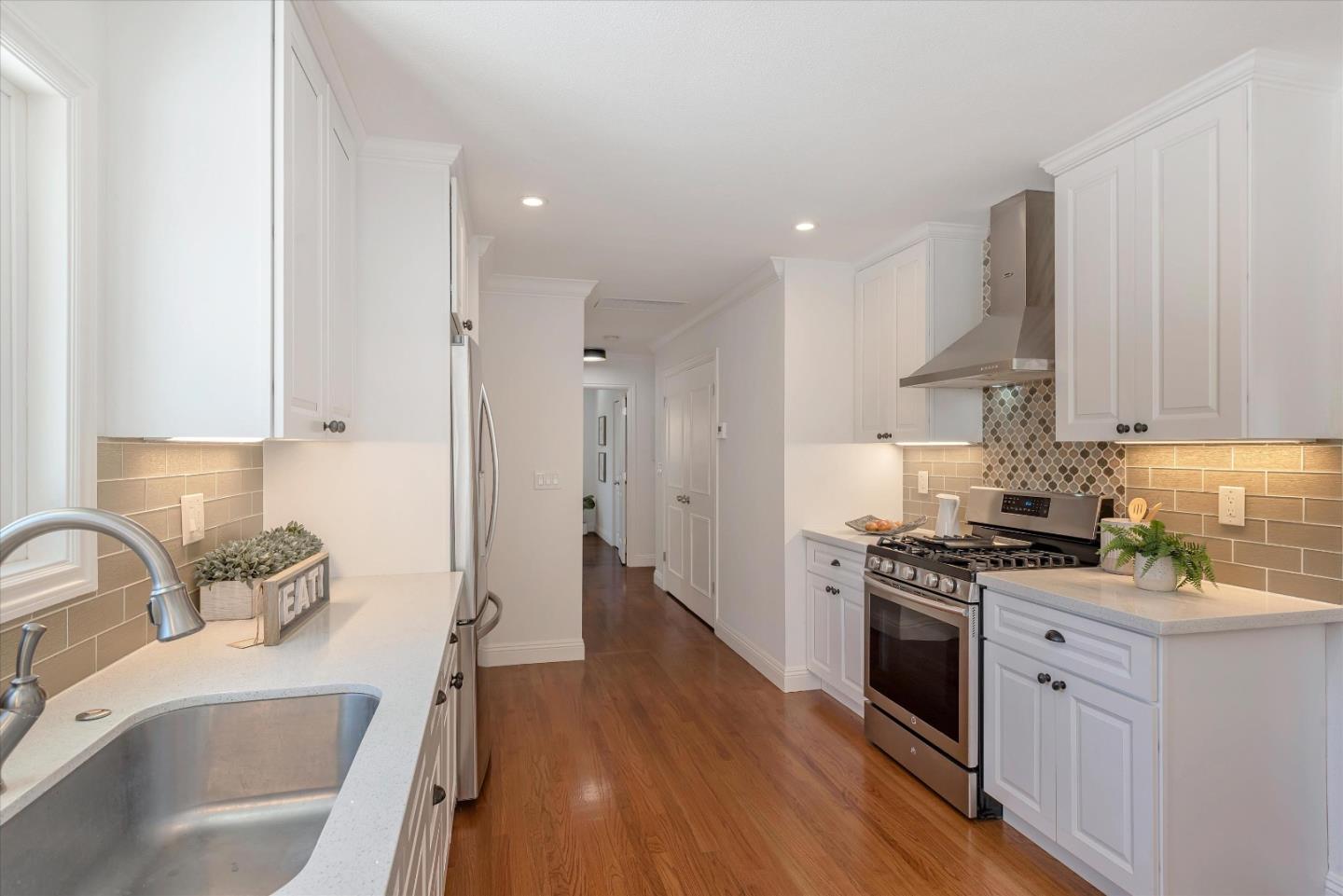 1314 Crestfield Drive San Jose, CA 95125 - Photo 10 of 43 a kitchen with stainless steel appliances granite countertop a sink stove and refrigerator