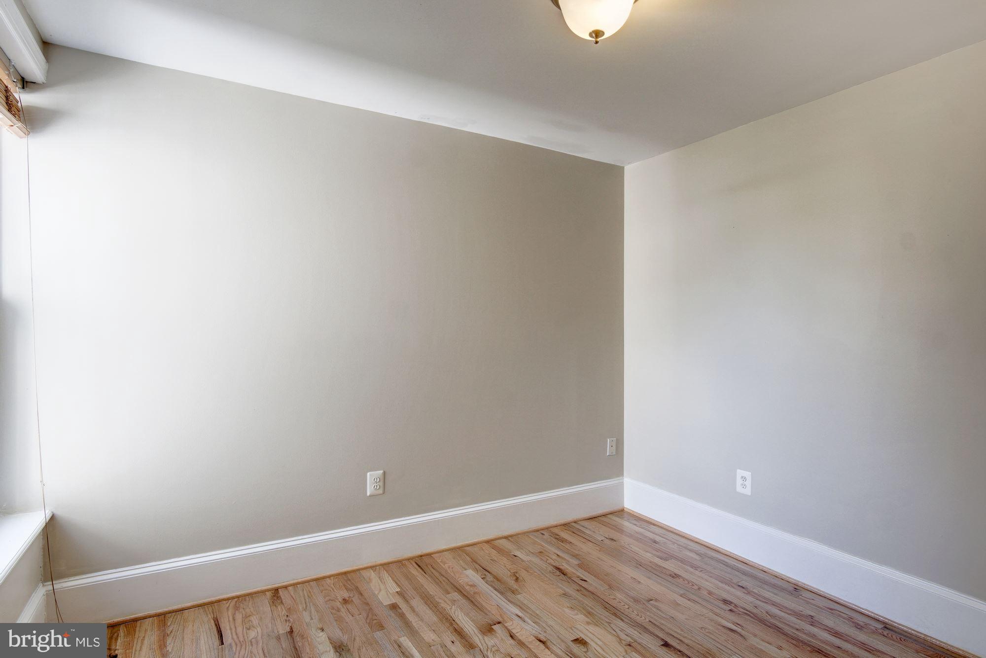1414 D Street Northeast Washington, DC 20002 - Photo 14 of 25 a view of an empty room with wooden floor