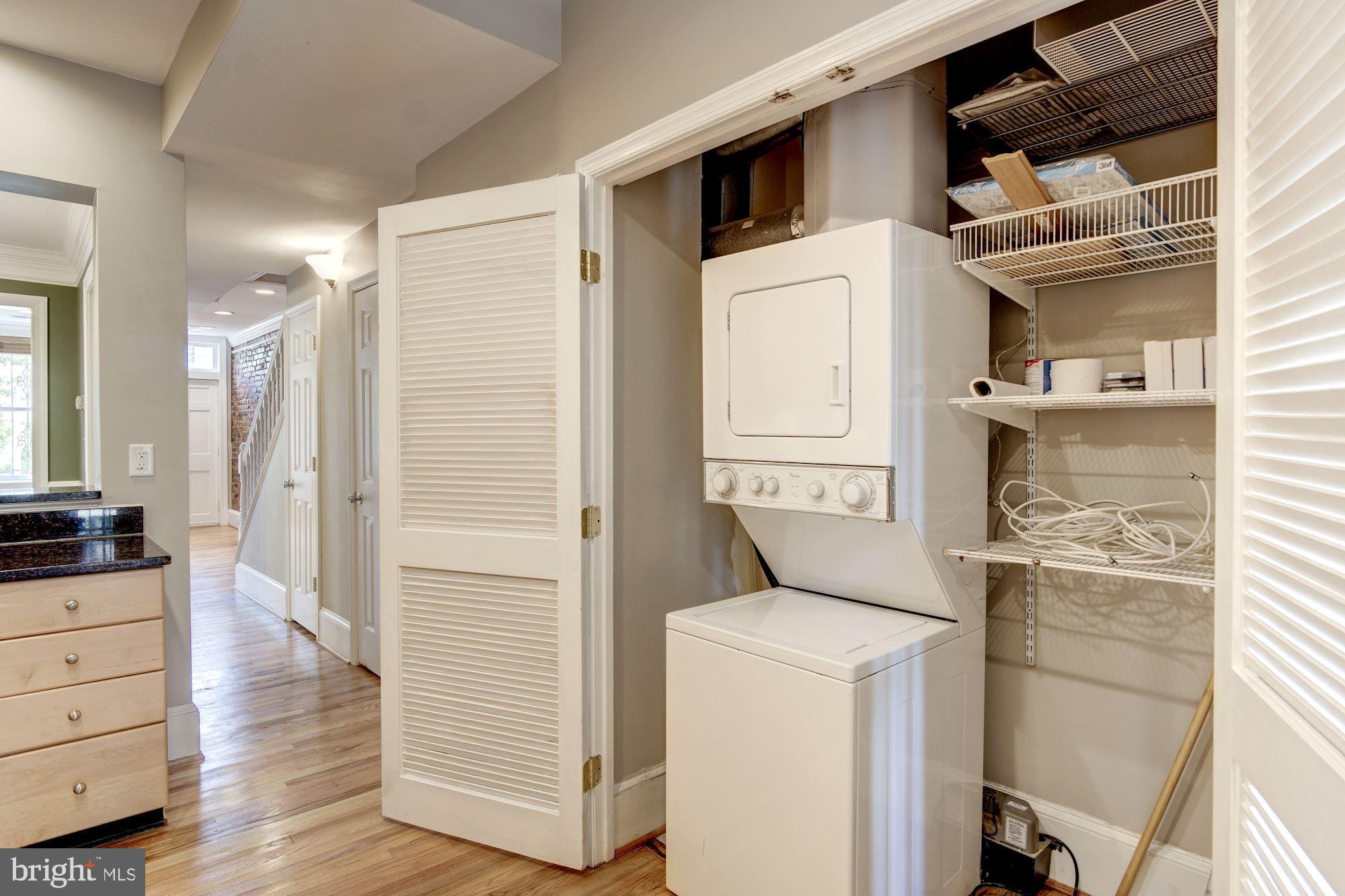 1414 D Street Northeast Washington, DC 20002 - Photo 18 of 25 a view of washer and dryer with wooden floor