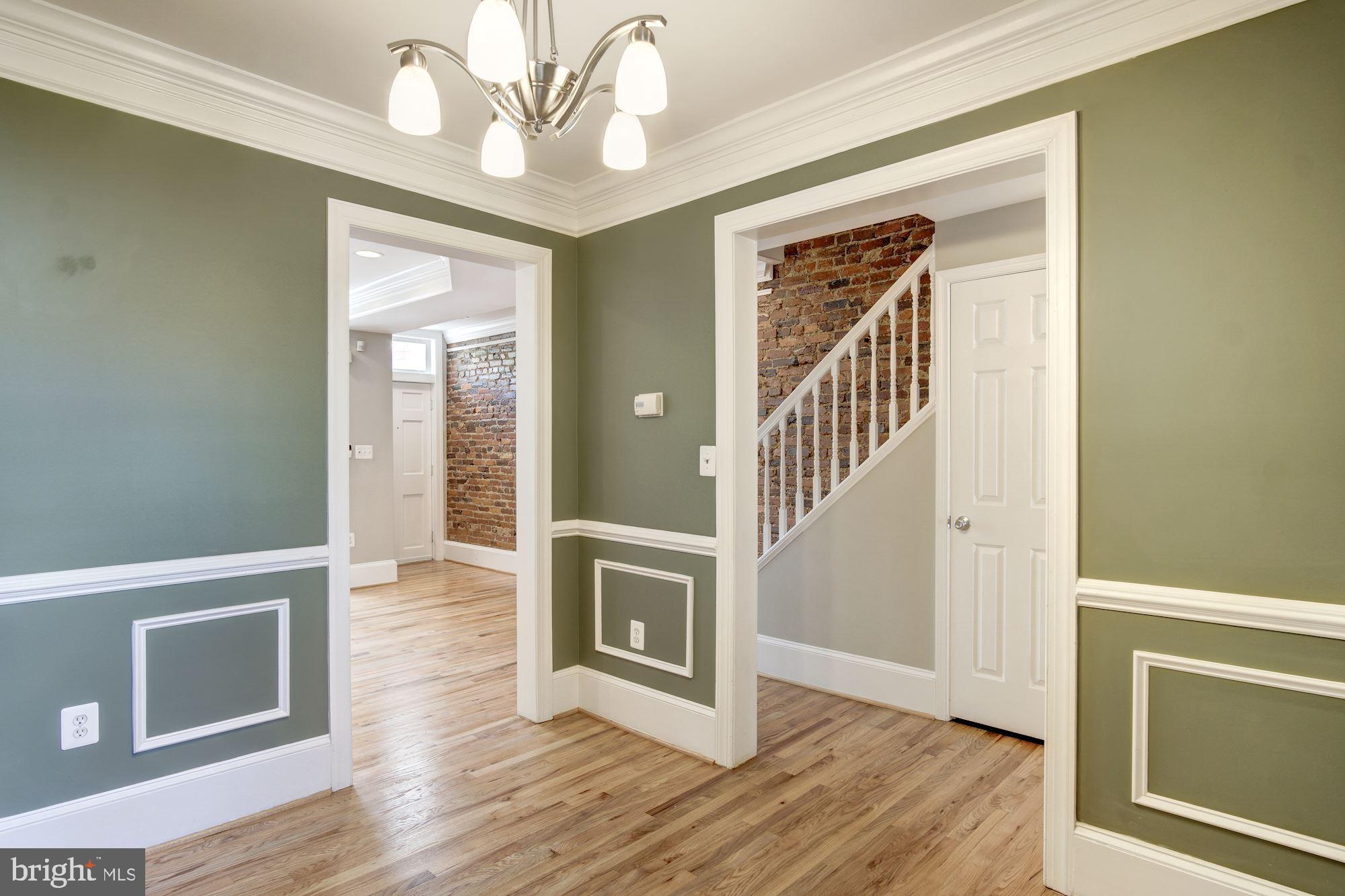 1414 D Street Northeast Washington, DC 20002 - Photo 6 of 25 a view of a livingroom with wooden floor and staircase