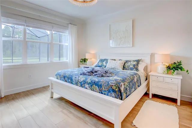 a bedroom with bed and balcony