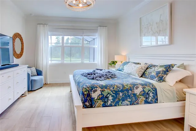 a living room with a bed and dresser