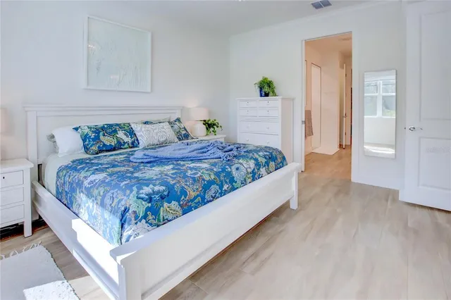 a spacious bathroom with double vanity and a bathtub