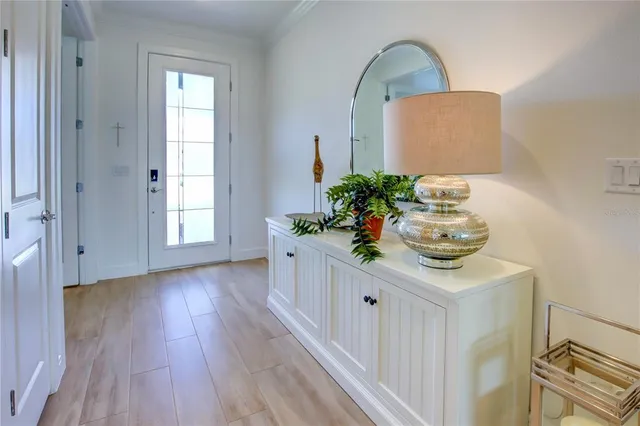 a view of living room with furniture and wooden floor
